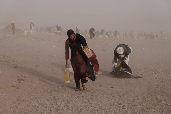 Afghan woman flees destruction after extreme weather events and earthquakes in Herat, Afghanistan